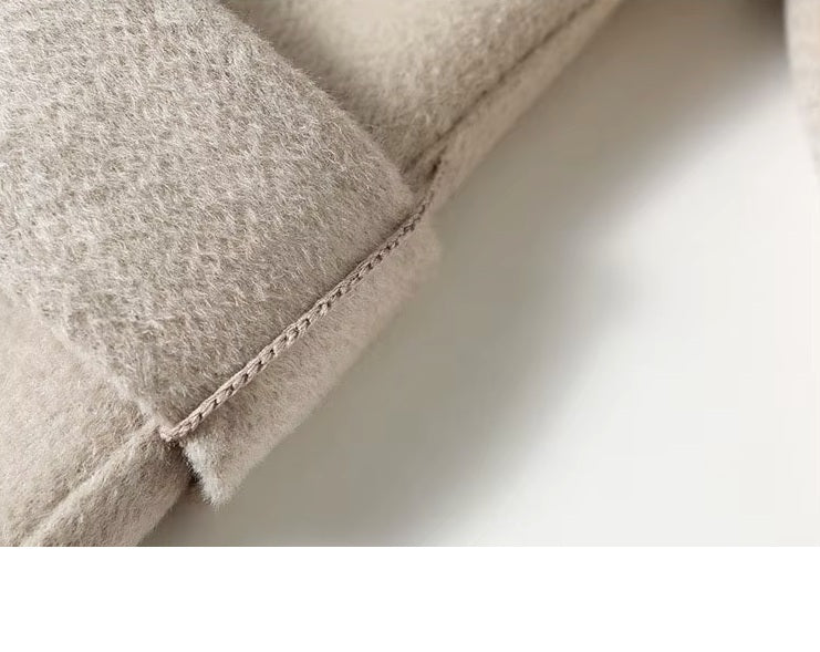 Thread belt loop detail on the Pearl Bush structured wool coat. From Borcelleclothes.