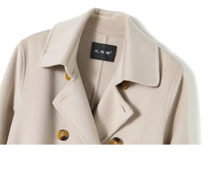 Upper part of the Pearl Bush structured wool coat shown on model, highlighting pointed collar and horn buttons. From Borcelleclothes.