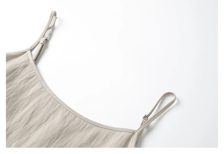 Close-up of adjustable shoulder straps on the dress — delicate detailing within a relaxed cut. From Borcelleclothes.