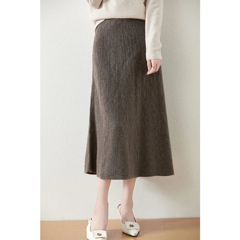 Textured merino wool skirt in Jasper, model with bent leg, showing natural flare and midweight drape — From Borcelleclothes.