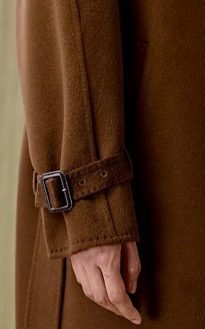 The sleeve on the Women's Tibetan Cashmere Coat in Baker’s Chocolate, featuring the adjustable belt with a rectangular buckle. From Borcelleclothes.