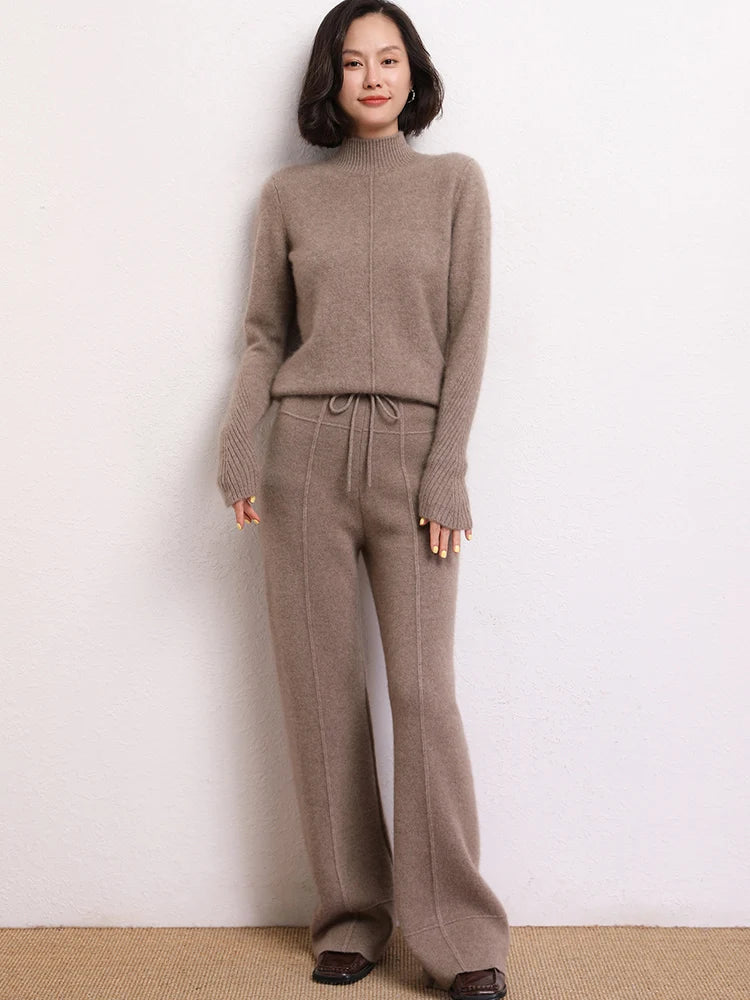 Model wearing Traced Seaming Cashmere Trousers in Almond Frost, foot forward — From Borcelleclothes.