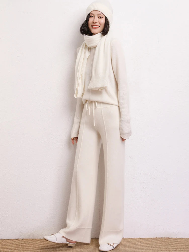 Model wearing Traced Seaming Cashmere Trousers in White Chocolate, lifted toes — From Borcelleclothes.