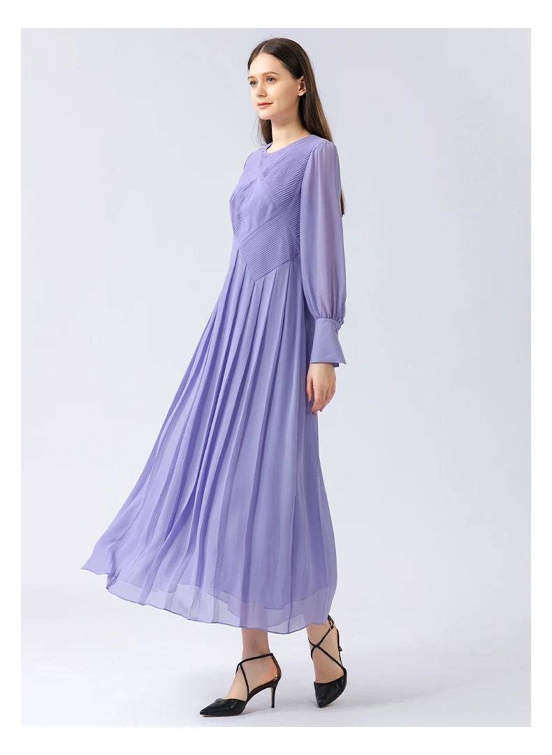 Side profile view, showing how the sculptural upper construction eases into wide pleats along the hips. From Borcelleclothes.