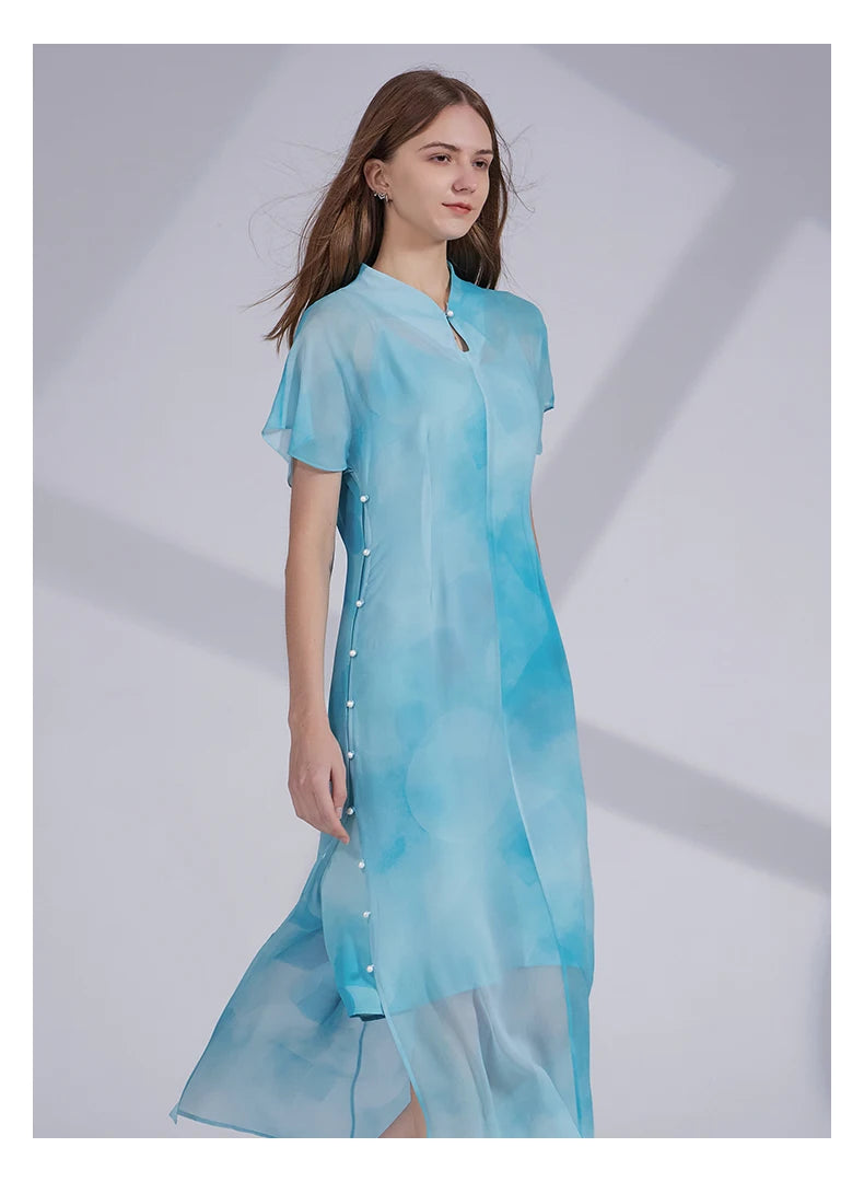 Model in Glacier silk ensemble standing with one knee bent, showing movement and relaxed drape of the outfit. From Borcelleclothes.