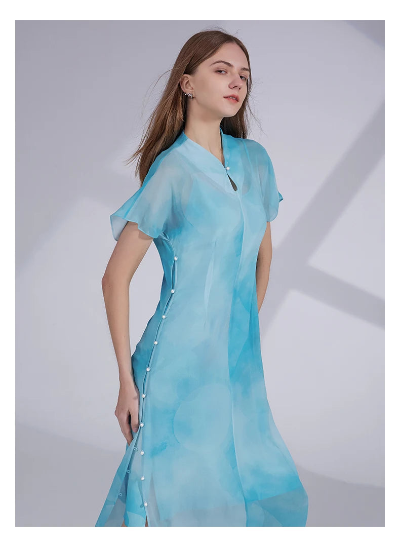 Model wearing Glacier-colored Mulberry silk ensemble with hands behind back, showing the calm structure of the outfit.  From Borcelleclothes.