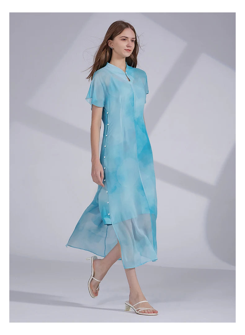 Model stepping to the side in the Glacier ensemble, highlighting the gentle flare and flowing hem. From Borcelleclothes.