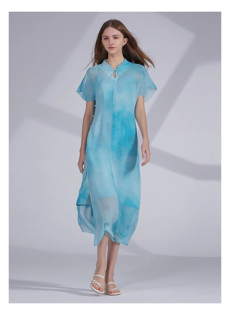 Model in Glacier ensemble watching to the side, showing the quiet balance of stillness and softness. From Borcelleclothes.