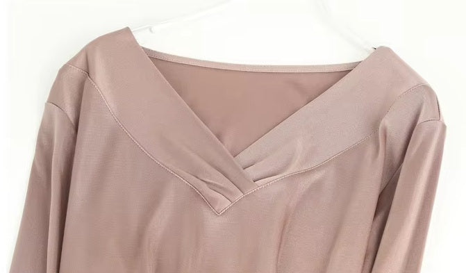 Detailed stitching and textured fabric on the collar of a Women's Vintage-Inspired Silk Top in Rose Fog, featuring a V-neckline with delicate pleats and long sleeves in a Mulberry Silk blend. From Borcelleclothes.