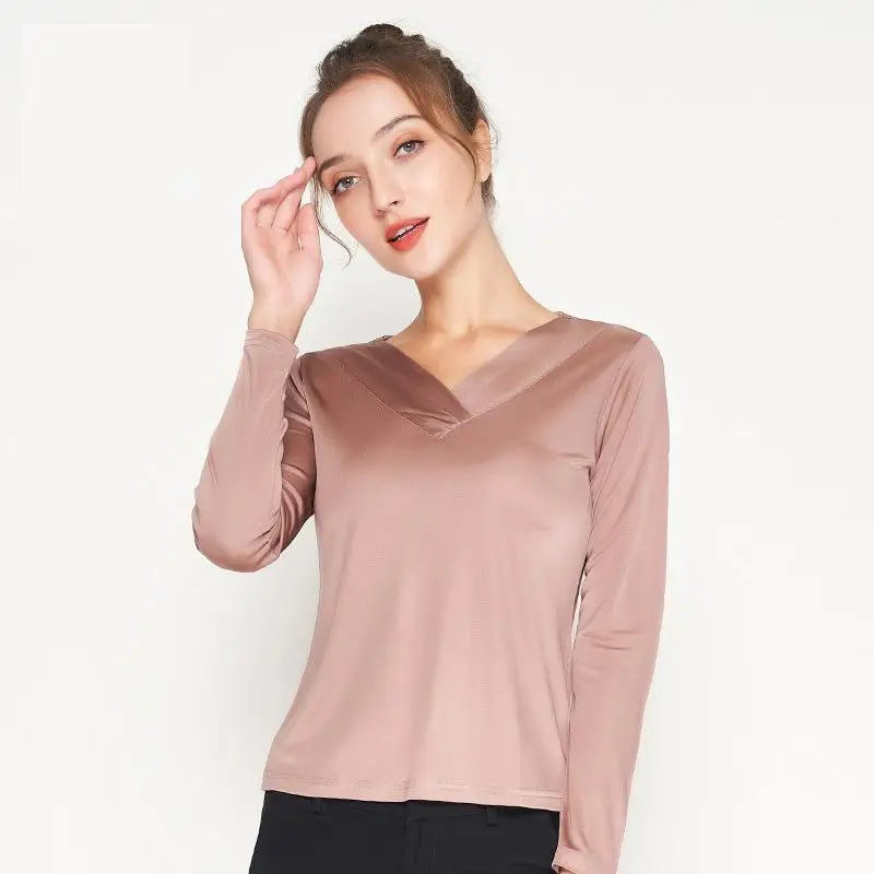 Women's Vintage-Inspired Silk Top in Rose Fog, a model is touching an eyebrow. From Borcelleclothes.
