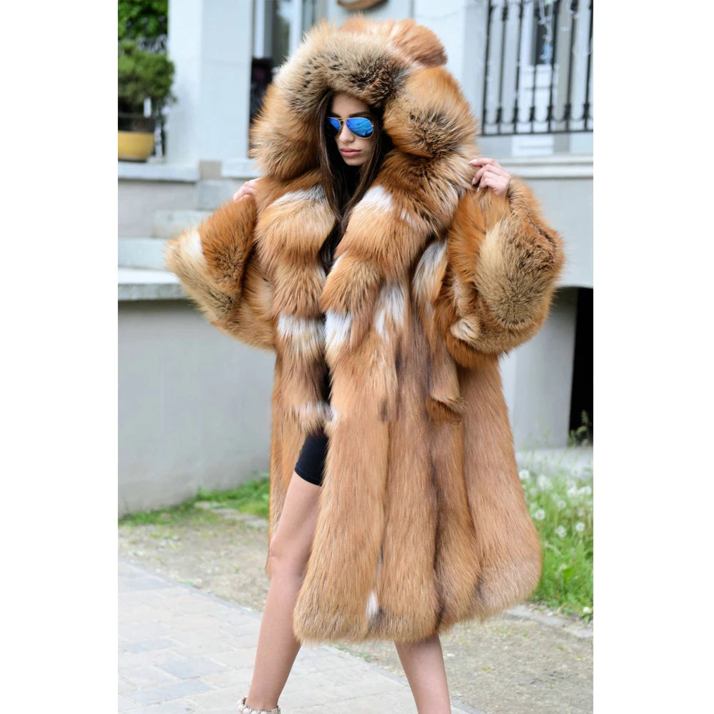 A woman gently places her hands on her shoulders, drawing attention to the plush collar and enveloping warmth of the whiskey silver fox fur coat. From Borcelleclothes.