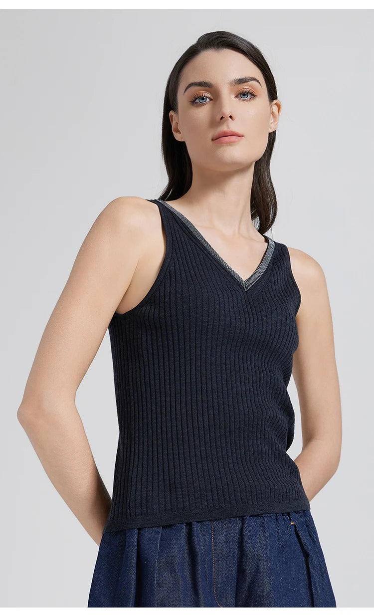 Model in Black Pearl wide-rib V-neckline top with hands placed behind the back. From Borcelleclothes.