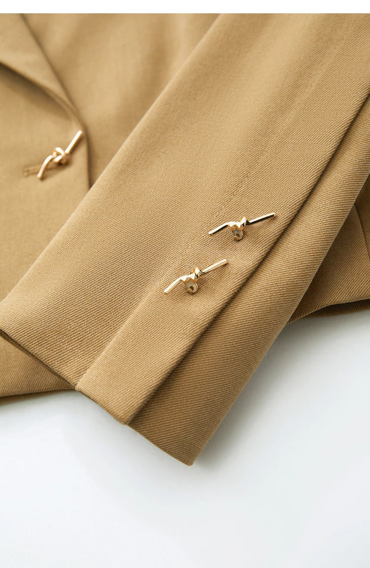 Close-up of cuff, sleeve dart, and buttons on the Women’s Wire Knot Detail Blazer in French Beige. From Borcelleclothes.