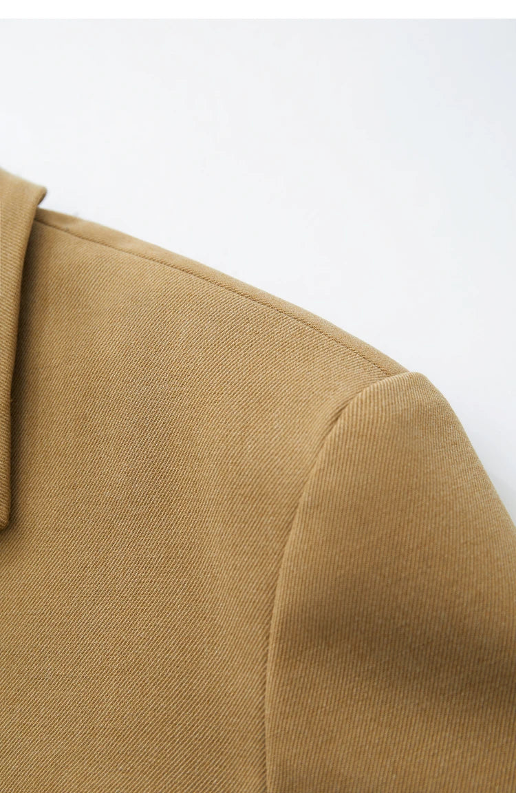 Detail of the shoulder construction on the Women’s Wire Knot Detail Blazer in French Beige. From Borcelleclothes.