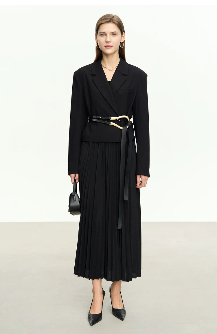 Women’s Wire Knot Detail Blazer in Onyx, model holding a bag with arms straight down. From Borcelleclothes.