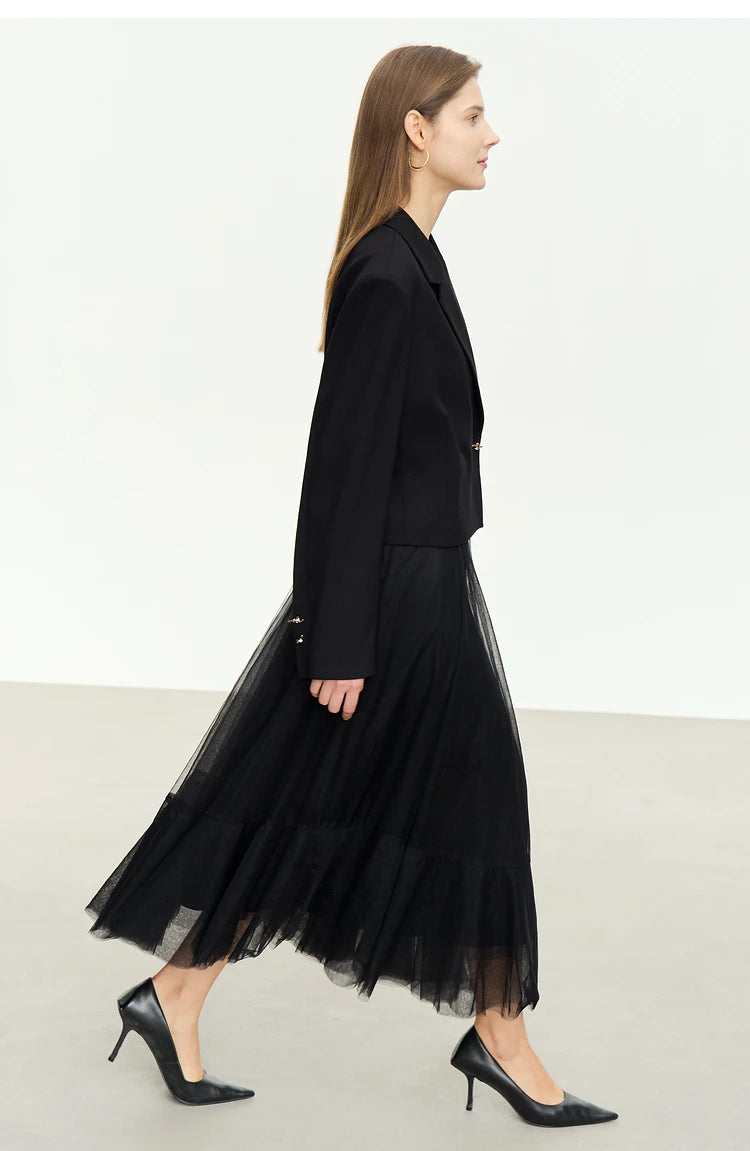 Women’s Wire Knot Detail Blazer in Onyx, model shown from the side. From Borcelleclothes.