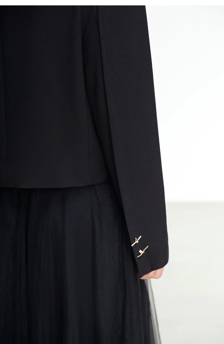 Close-up of sleeve dart and cuff buttons on the Women’s Wire Knot Detail Blazer in Onyx. From Borcelleclothes.