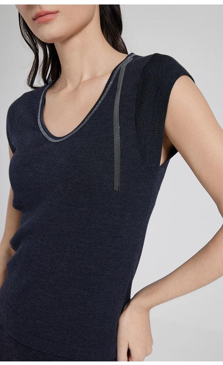 Model in wool-silk Black Pearl top with one hand on her hip, displaying the elegant slim fit. From Borcelleclothes.