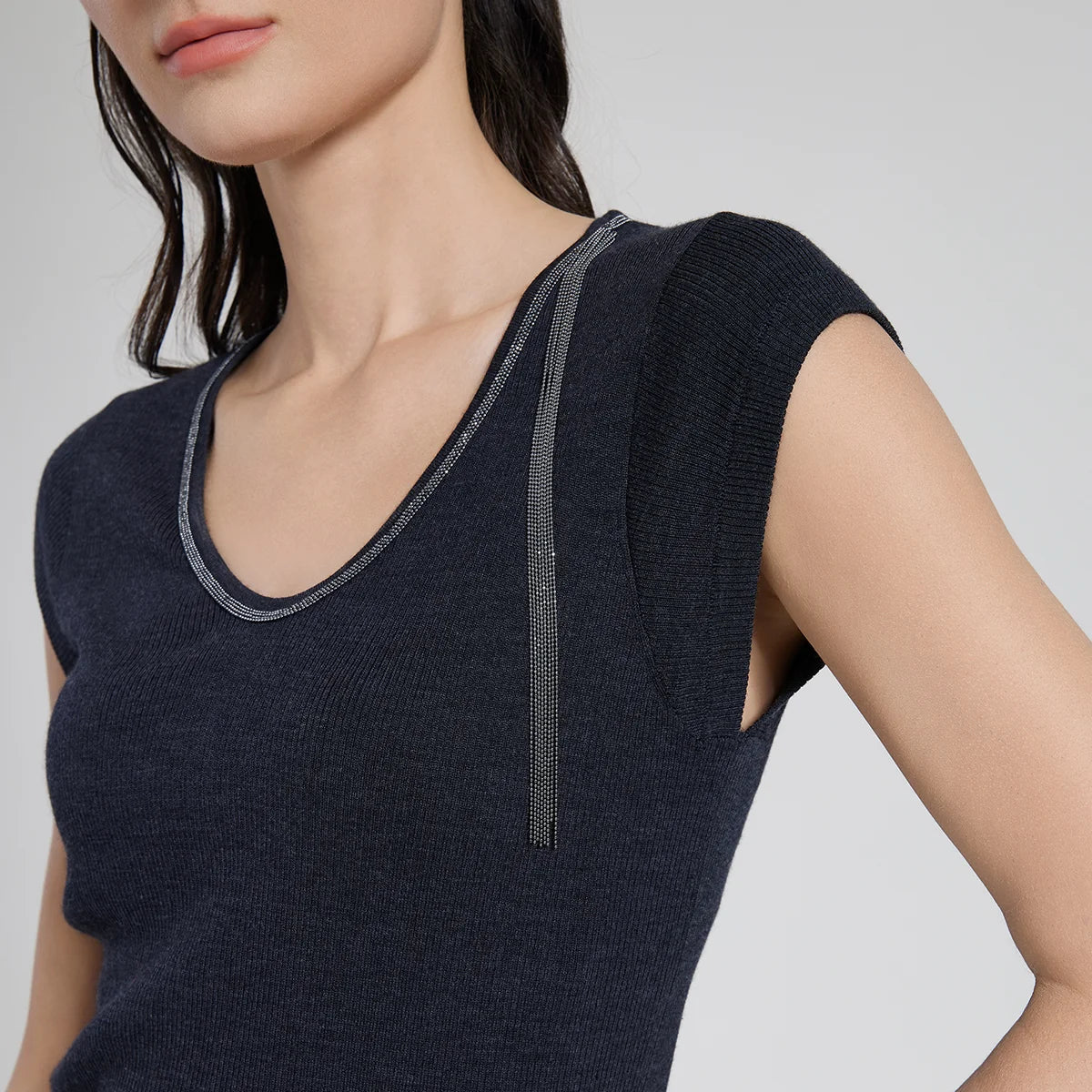 Close-up of the upper part of the wool-silk top in Black Pearl, highlighting the rhinestone-trimmed neckline and cap sleeves. From Borcelleclothes.