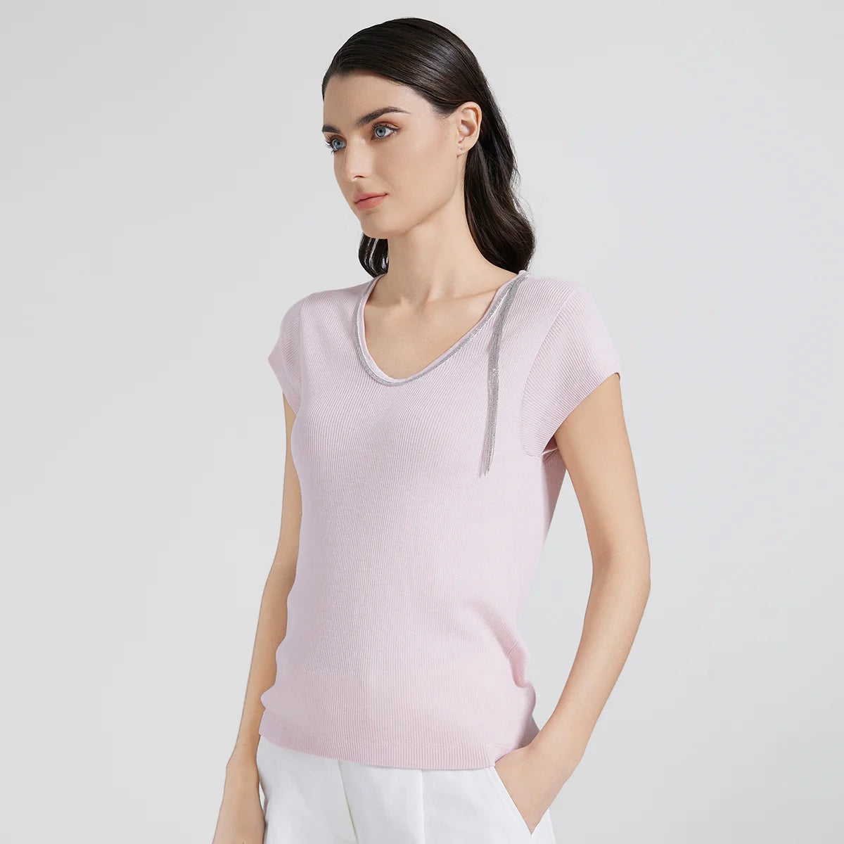 Model in Prim wool-silk top turned slightly to the side, emphasizing the soft hourglass silhouette. From Borcelleclothes.
