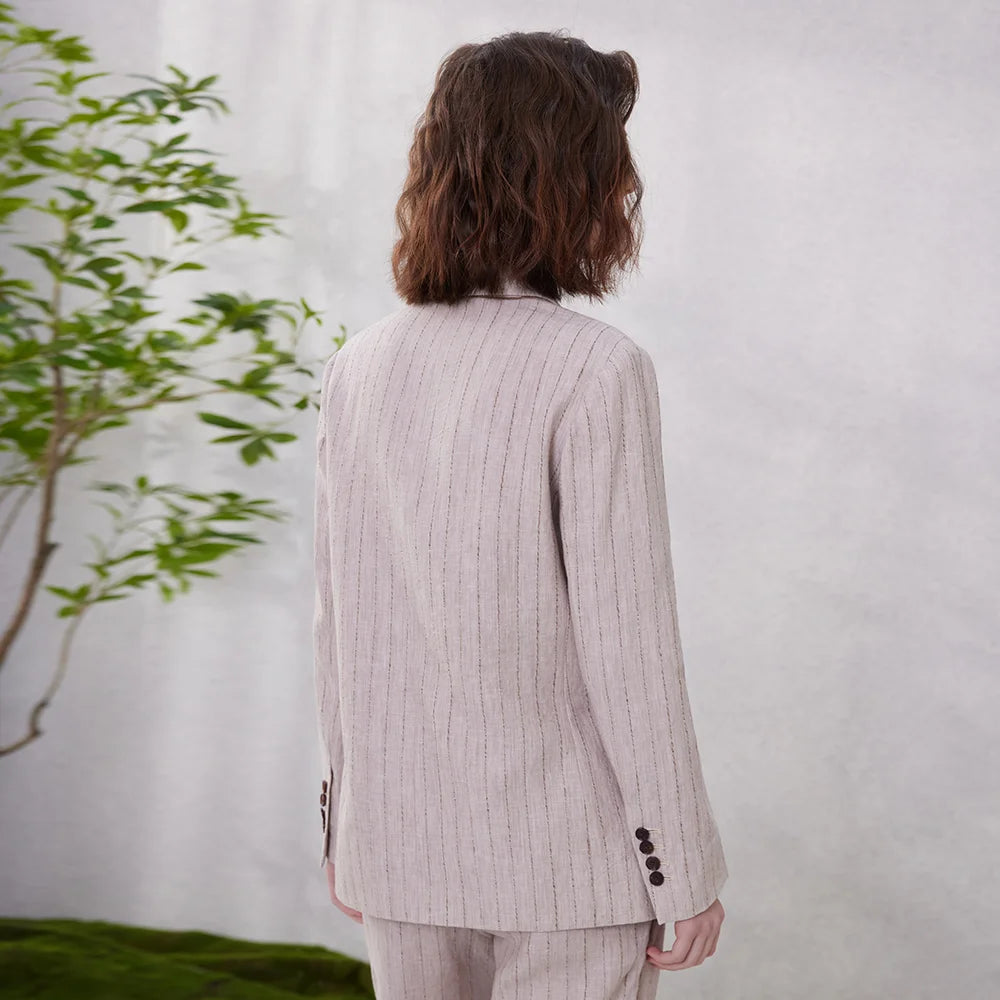 Back view of women’s woven stripes linen blazer in Pink Swan shade, showing woven striped detail. From Borcelleclothes.