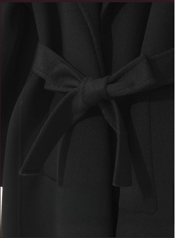 Tied belt in a bow of a Women's Wrap Cashmere coat in Onyx. From Borcelleclothes.
