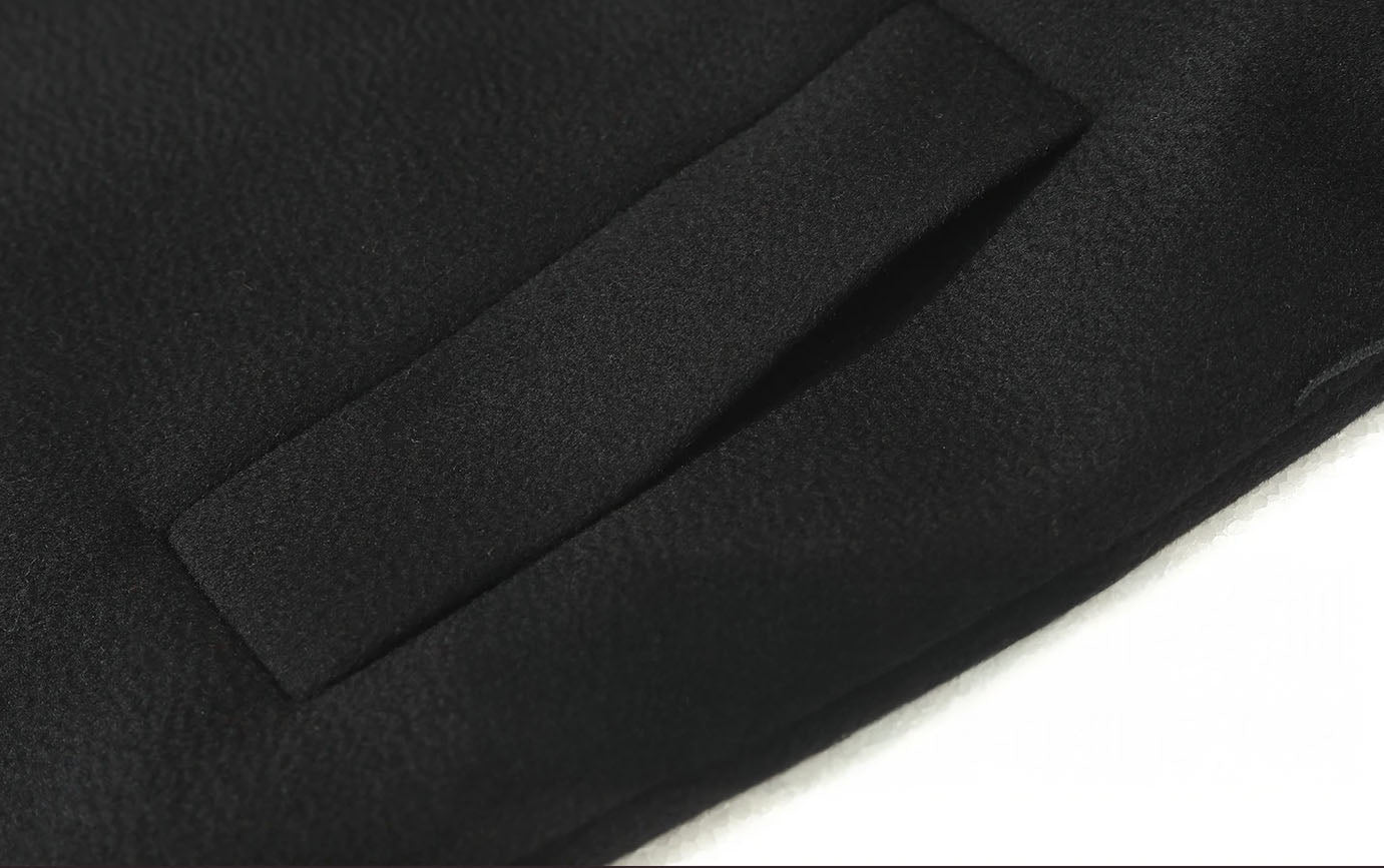 Welt pocket of a Women's Wrap Cashmere coat in Onyx. From Borcelleclothes.