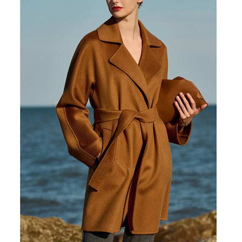 Women's mid-thigh wrap coat in Rich Gold cashmere with kimono sleeves and notch lapels. From Borcelleclothes.