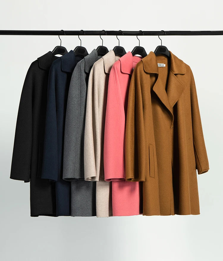 Cashmere wrap coats in all available colors hanging on hangers. From Borcelleclothes.