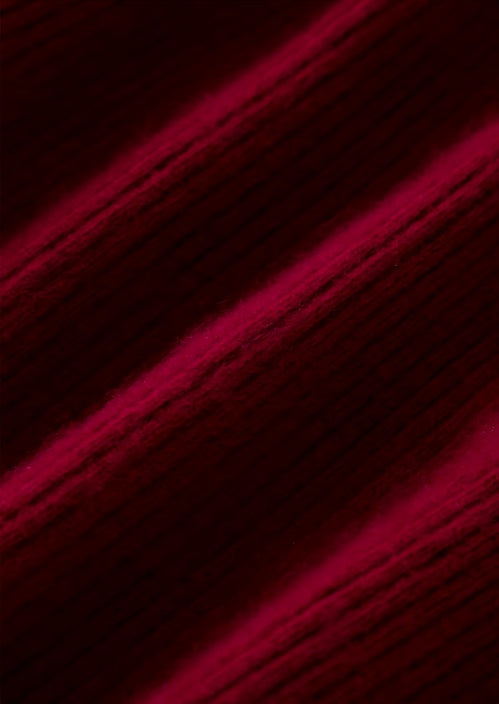 Demonstration of the Claret Australian Wool fabric’s drape, highlighting its soft, structured texture and luxurious flow. From Borcelleclothes.