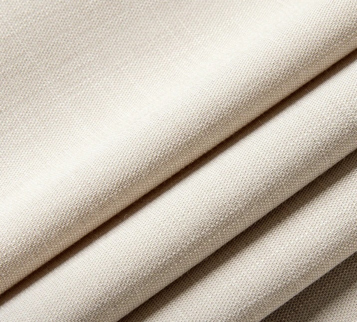 Close-up of the alabaster fabric, showing its soft texture and natural folds. From Borcelleclothes.