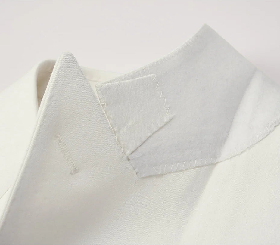 The Men's Alabaster Merino Wool Suit's blazer felt undercollar, showcasing impecable craftsmanship. From Borcelleclothes.
