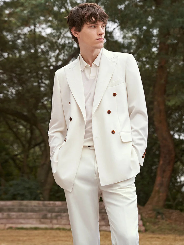 Men's Alabaster Merino Wool Suit showcasing a double-breasted blazer with peaked lapels, horn-brown buttons, and tailored pants, crafted from a premium blend of 95% wool and 5% cashmere for an understated yet sophisticated look. From Borcelleclothes.