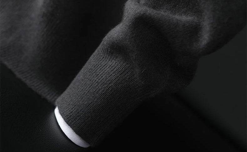 Cuff of a Men’s Button Placket Cashmere Sweater in Charcoal Grey. — From Borcelleclothes.