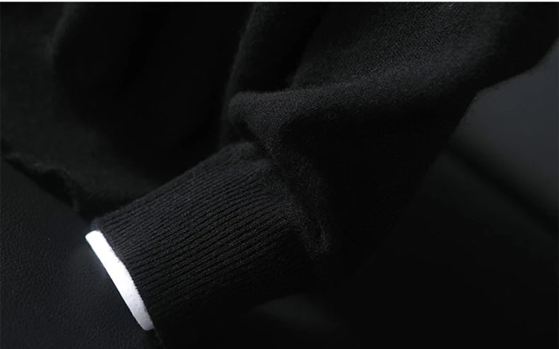 Cuff of a Men’s Button Placket Cashmere Sweater in Onyx. — From Borcelleclothes.