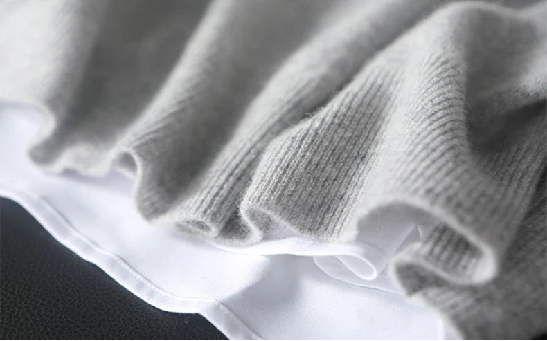 Men’s Button Placket Cashmere Sweater in Silver Sand, close-up of a ribbed bottom hem — From Borcelleclothes.