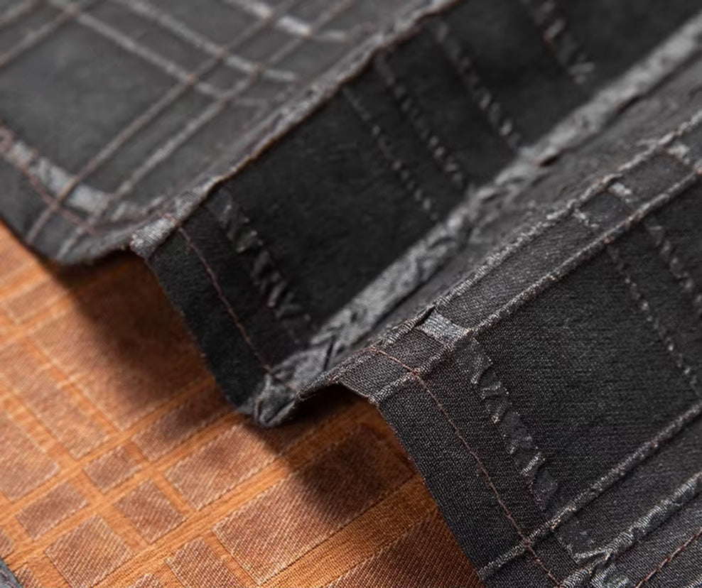 Detailed view of the clean, straight bottom hem finish on a premium dark graphite Xiangyunsha silk shirt — From Borcelleclothes.