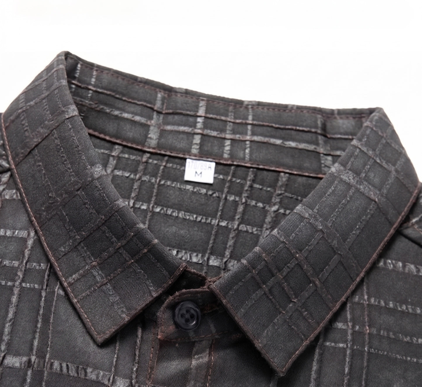 Close-up view of the classic structured collar on a dark graphite checkered Xiangyunsha silk shirt — From Borcelleclothes.