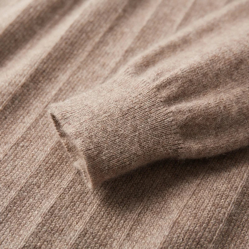 The ribbed cuff on the Men's Crossover V-Neck Cashmere Sweater in Sandrift, showcasing its polished finish and refined craftsmanship. From Borcelleclothes.