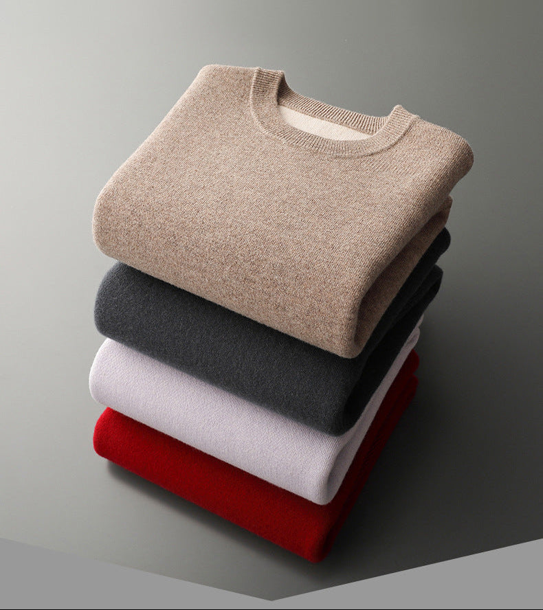 Folded stack of men’s double-faced fine wool sweaters displaying all available colors and the contrasting interior knit along the collar — From Borcelleclothes.