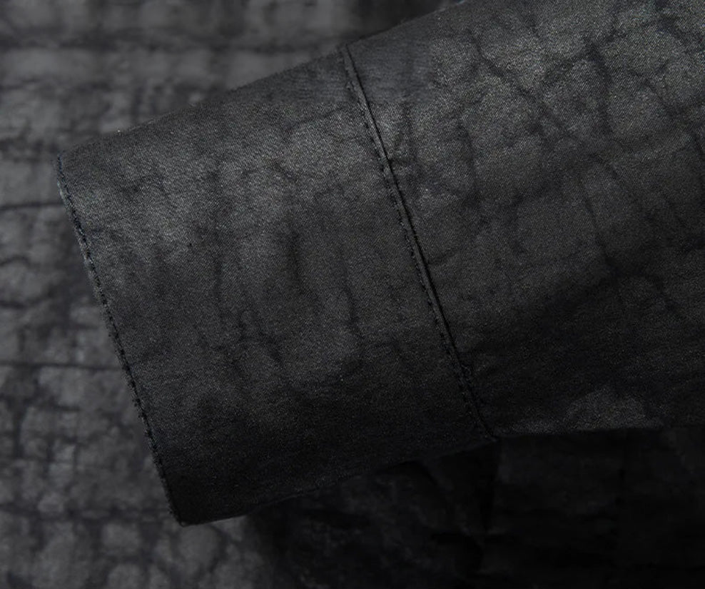 Close-up of the buttoned sleeve cuff, sealing the wrist with a disciplined, elegant finish that marks the impeccable craftsmanship of this Guangdong silk shirt — From Borcelleclothes.