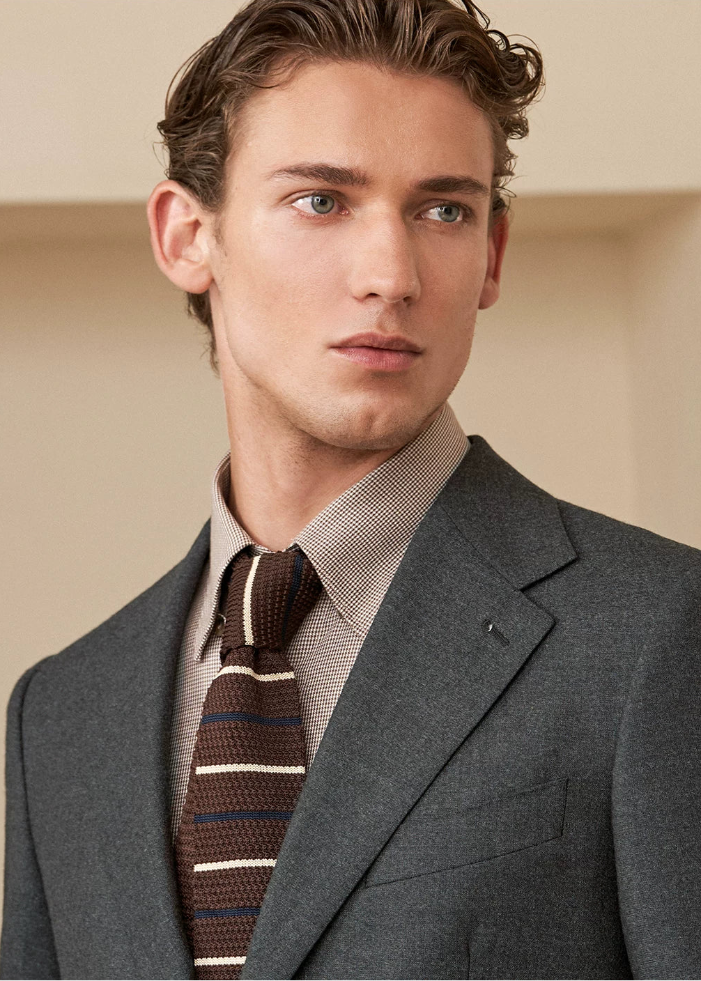 Portrait shot showcasing the soft unpadded shoulder, notch lapel roll, and Neapolitan barchetta chest pocket — From Borcelleclothes.