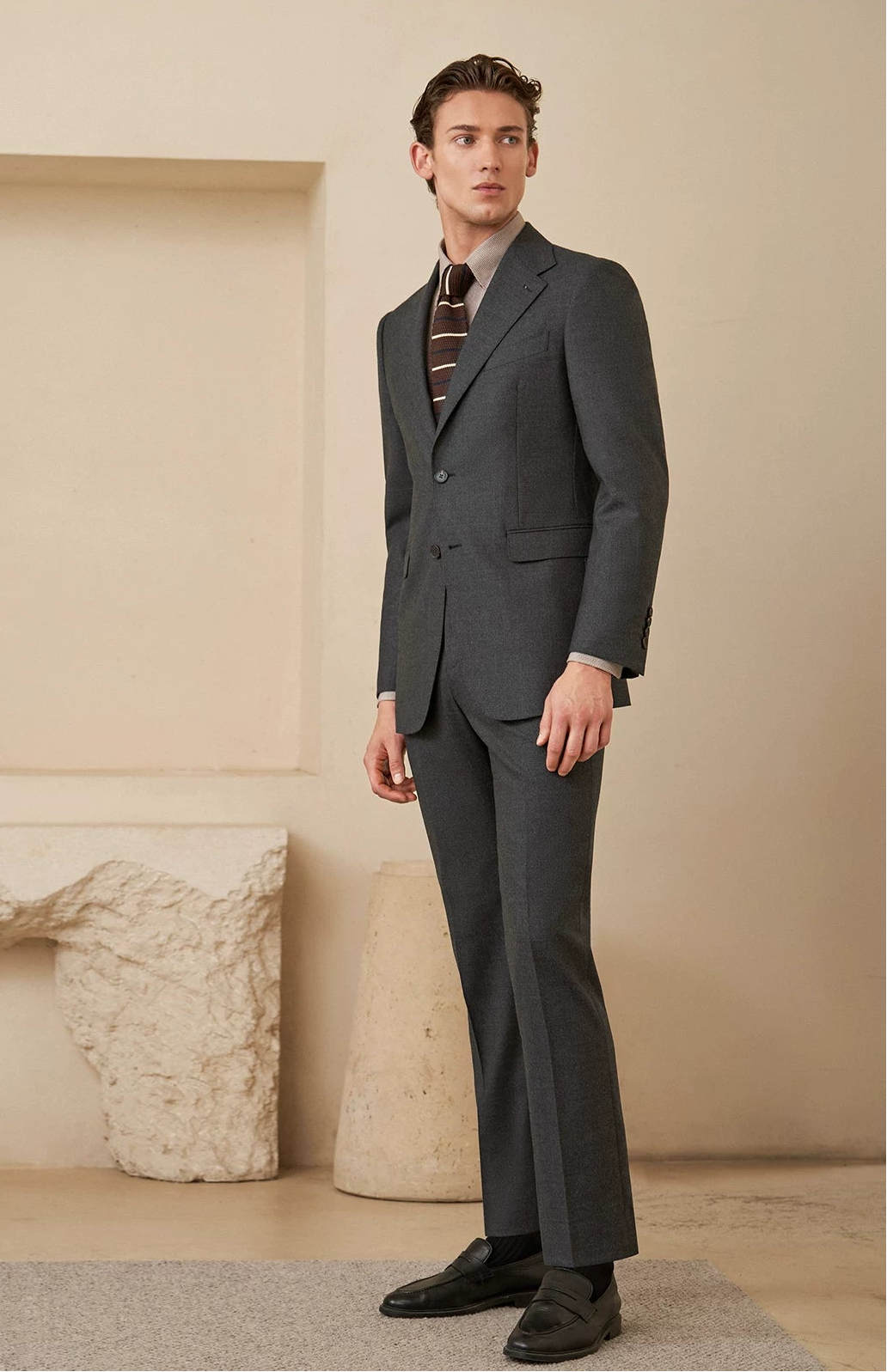 Three-quarter full-height view demonstrating the proportional silhouette and elegant drape of the flannel suit — From Borcelleclothes.
