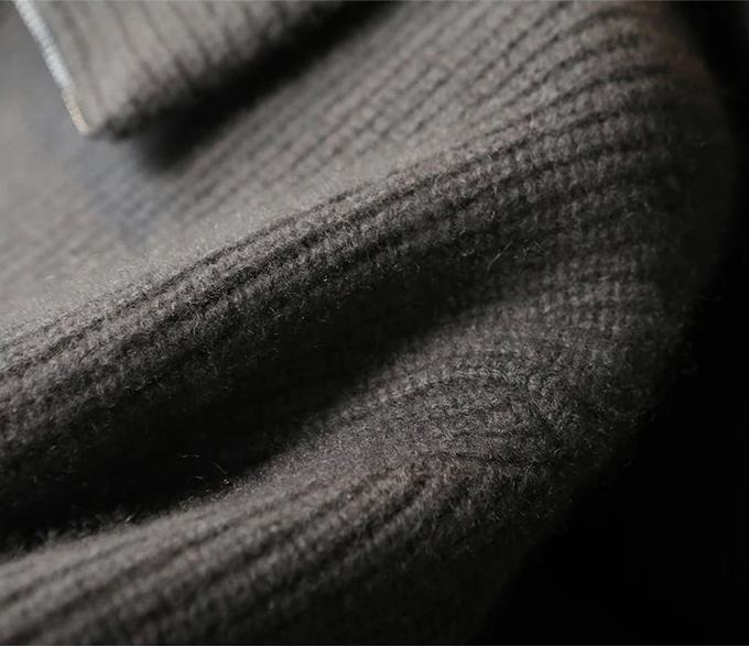 Detailed look at the relaxed drop-shoulder seam construction on the Concord heavyweight cashmere zip cardigan — From Borcelleclothes.