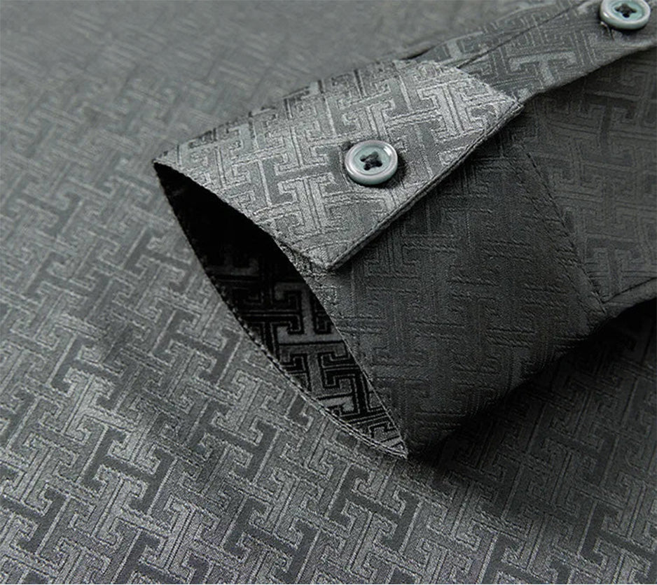 Sharp close-up of the tailored single-button cuff on the long sleeve of the grey Mulberry silk shirt — From Borcelleclothes.