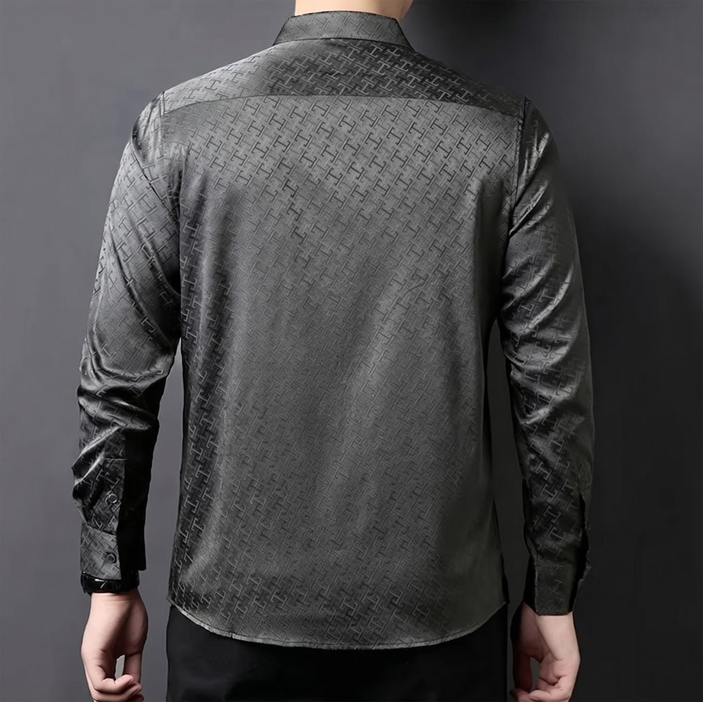 Rear view of a man wearing the premium Graphite Bonds silk shirt, showcasing the precise fit of the classic back yoke and clean shoulder structure — From Borcelleclothes.