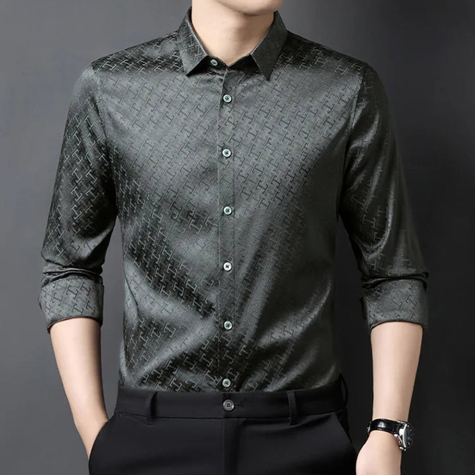 A man rolled up the sleeve of his grey Mulberry silk shirt, showing the subtle sheen of the Jacquard Labyrinth texture — From Borcelleclothes.