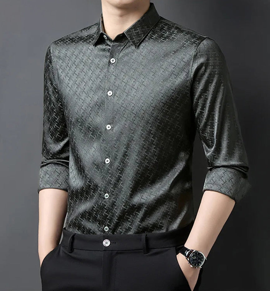 A man standing in a premium long-sleeve Mulberry silk shirt in Graphite Bonds grey, his hands resting confidently in his trousers pockets — From Borcelleclothes.