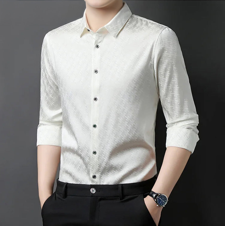 Side profile of a man wearing the luxury ivory white silk shirt, showcasing the clean drape and structured relief of the labyrinth weave — From Borcelleclothes.