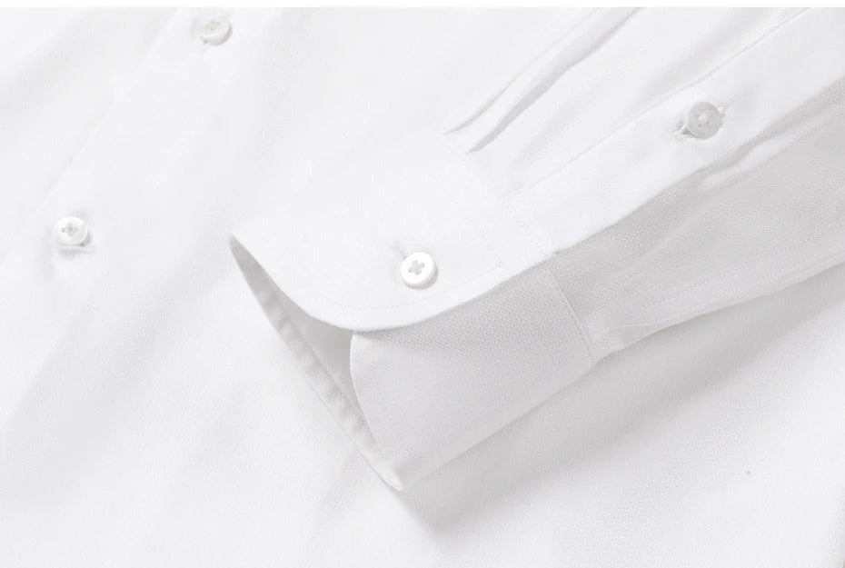 Close-up of the sleeve placket and structured one-button cuff, showcasing the flawless stitching on the 87% cotton and 13% Mulberry silk fabric. — From Borcelleclothes.